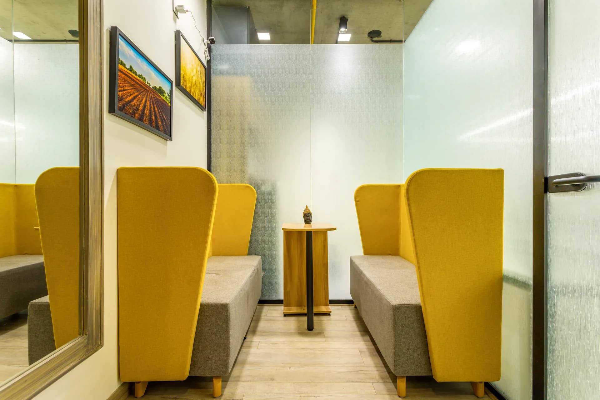A vibrant pantry and breakout area combining warm wood finishes, bright seating, functional dining spaces, and an open layout for casual interactions and refreshing breaks.