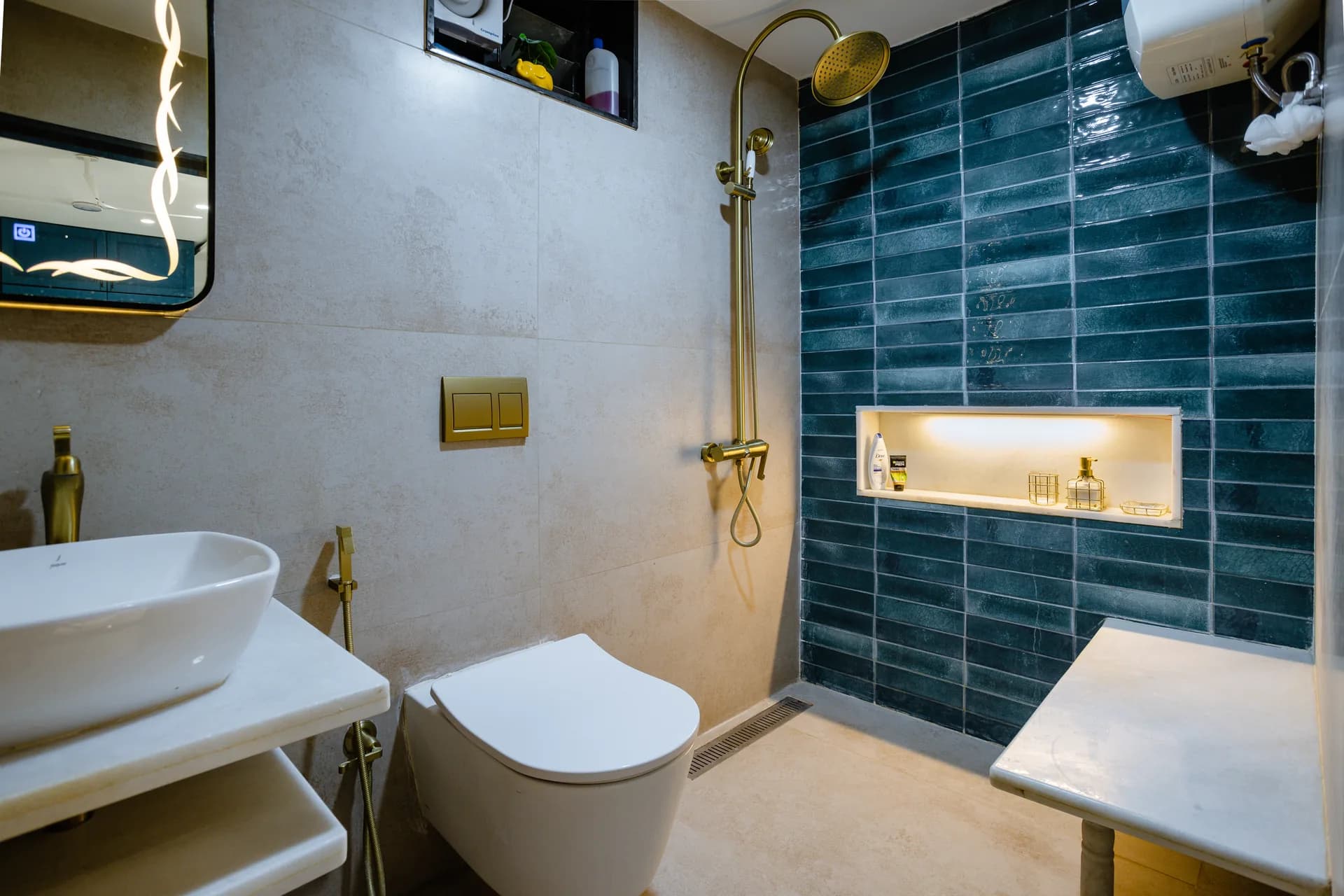 A refined washroom featuring textured wall finishes, patterned tiles, elegant gold accents, statement mirrors, and modern fixtures, creating a sophisticated balance of functionality and visual character.